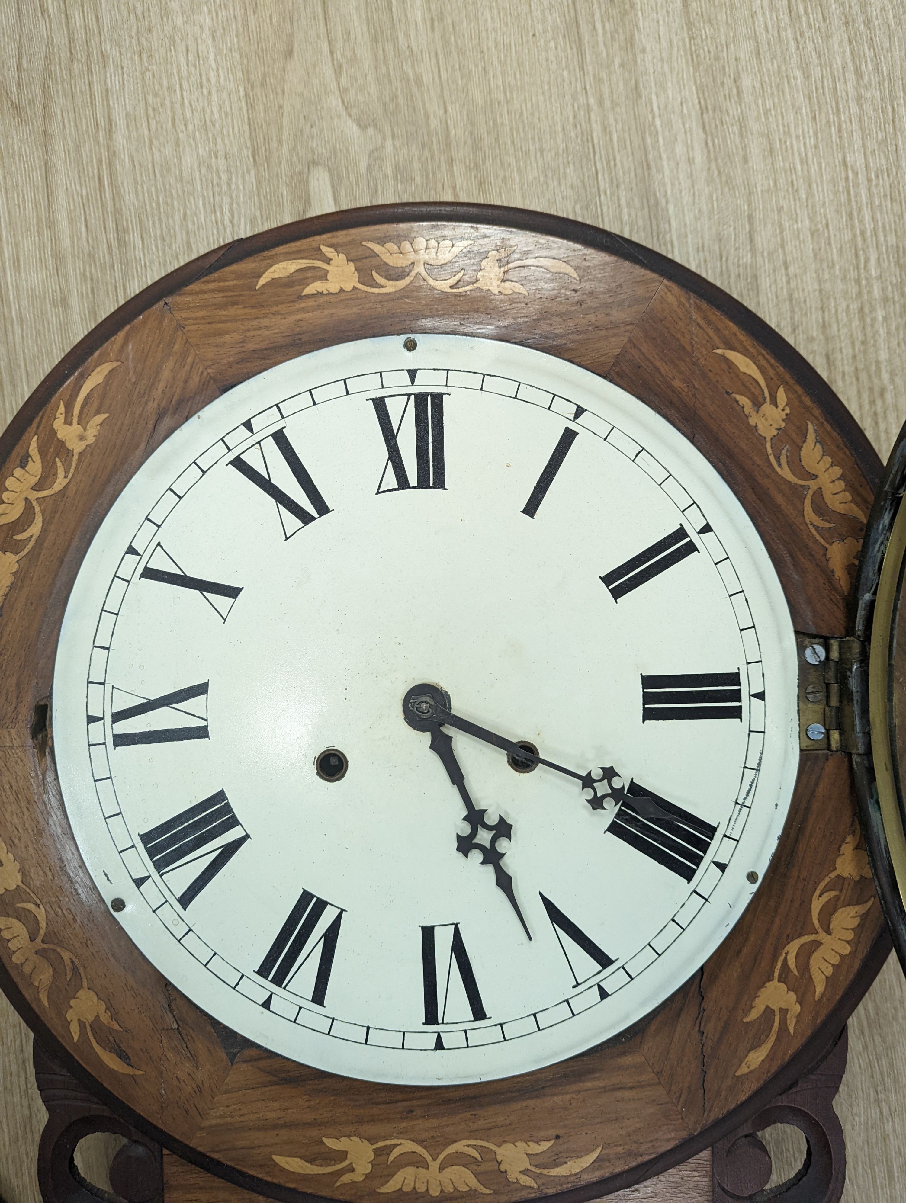 An American marquetry drop dial wall clock, 27cm enamelled dial, with key and pendulum